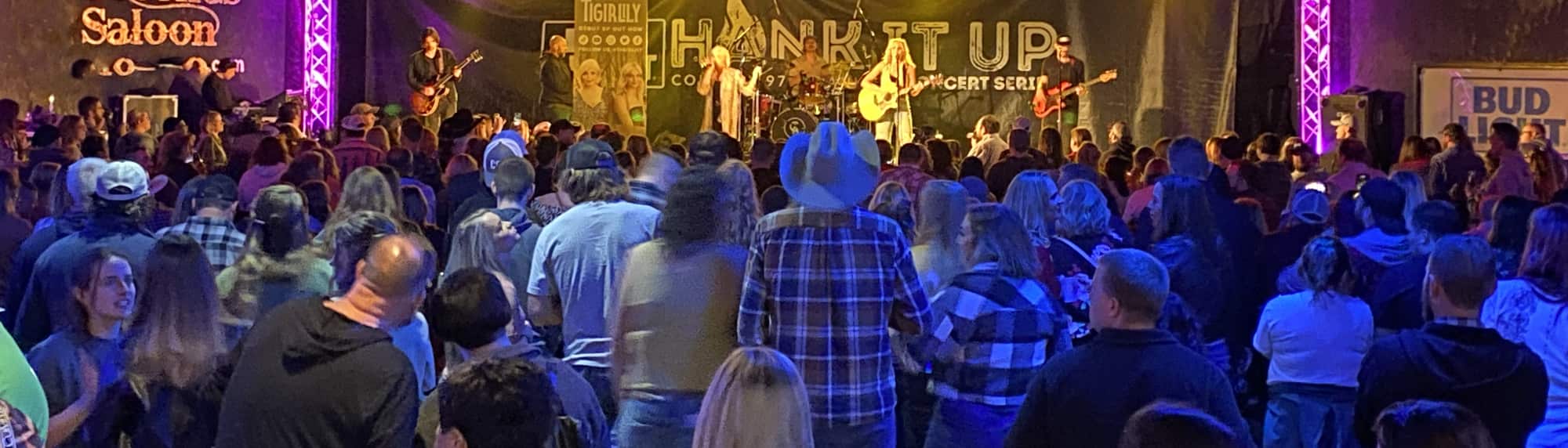 country concert with fans wearing cowboy hats Virginia Beach