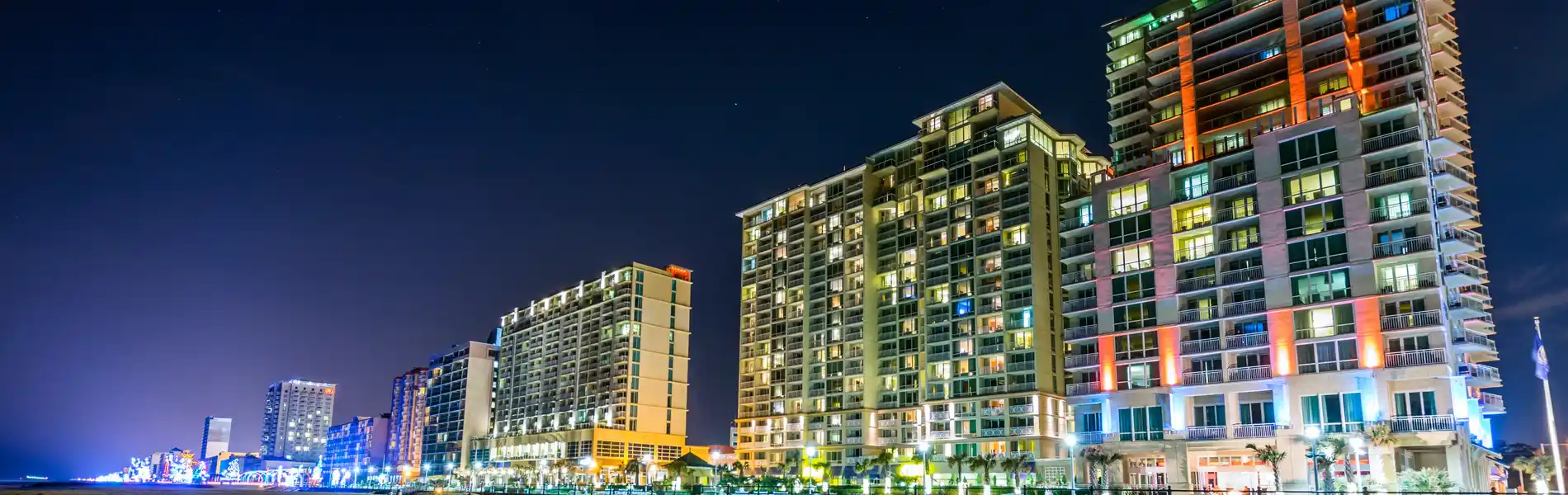 Neon color image of a band playing and people singing along